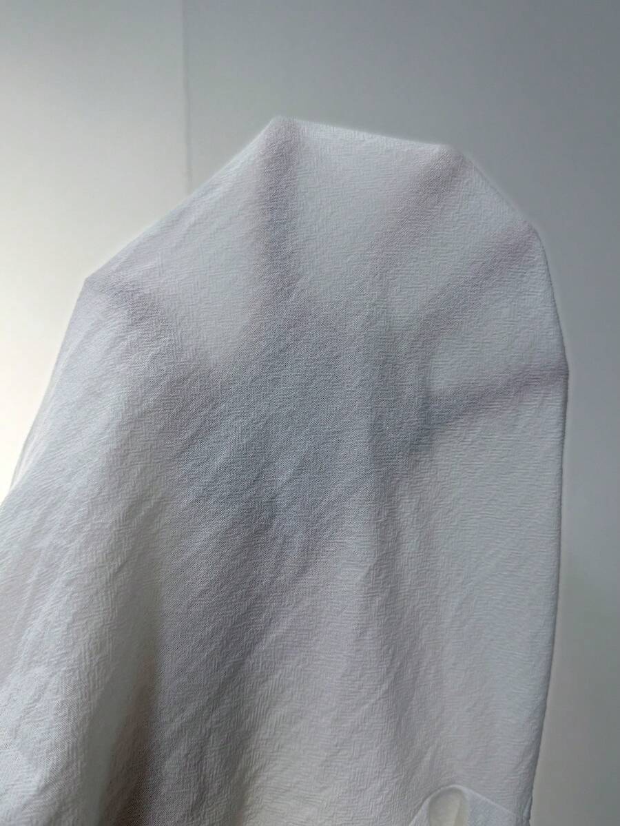 Women's white 100% cotton straight leg pants with an elastic drawstring waist and side pockets, styled in a loose casual fit.