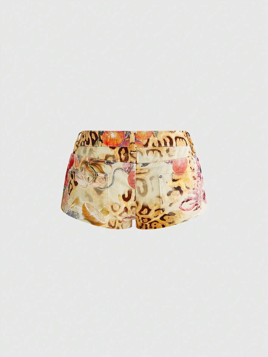 Women's yellow ultra low waist mini denim shorts featuring floral and leopard print with button zipper closure and pockets.