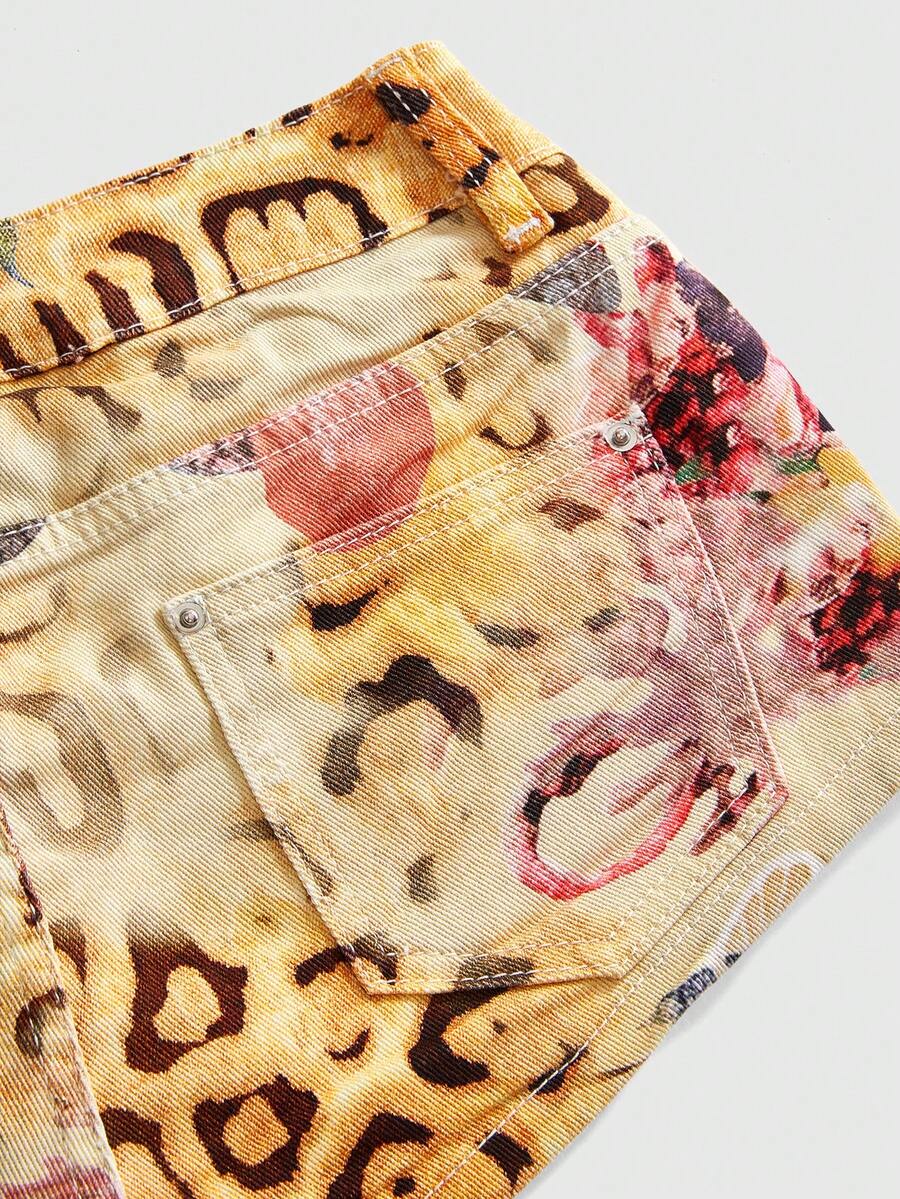 Women's yellow ultra low waist mini denim shorts featuring floral and leopard print with button zipper closure and pockets.
