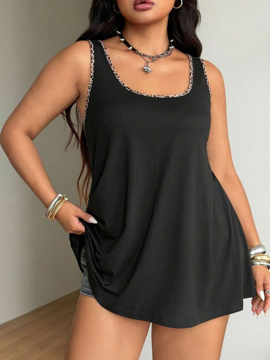 Women's camouflage print tank top featuring a scoop neckline and knitted stretch fabric in army green.