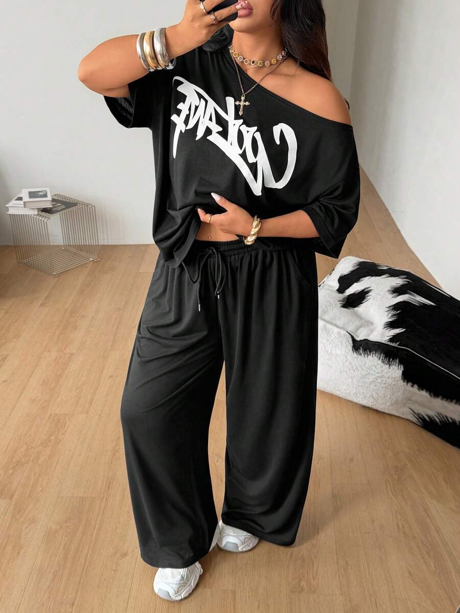 Women's two-piece lounge set featuring a loose drop shoulder asymmetrical neck short sleeve t-shirt and wide-leg knit pants with pockets.