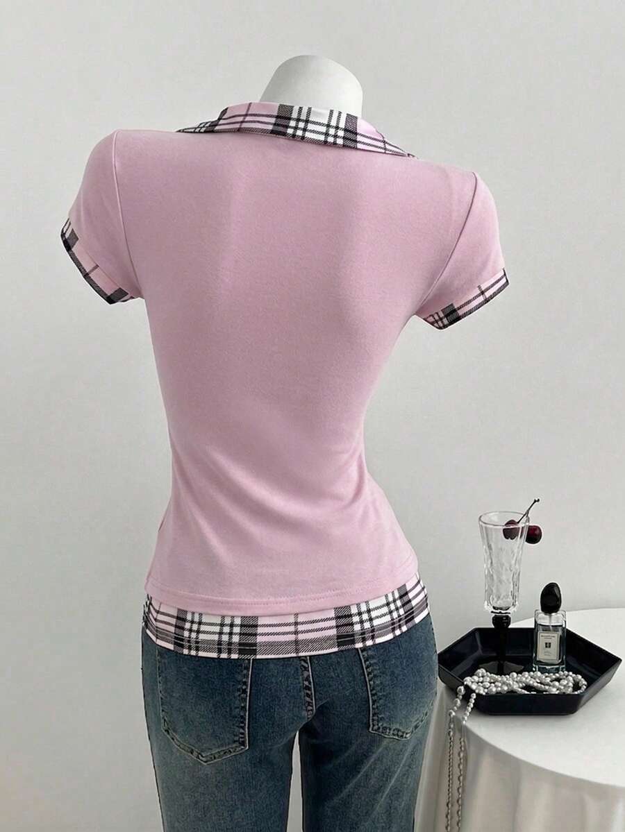 Women's black short sleeve slim fit 2-in-1 t-shirt with a plaid patchwork shirt collar detail.