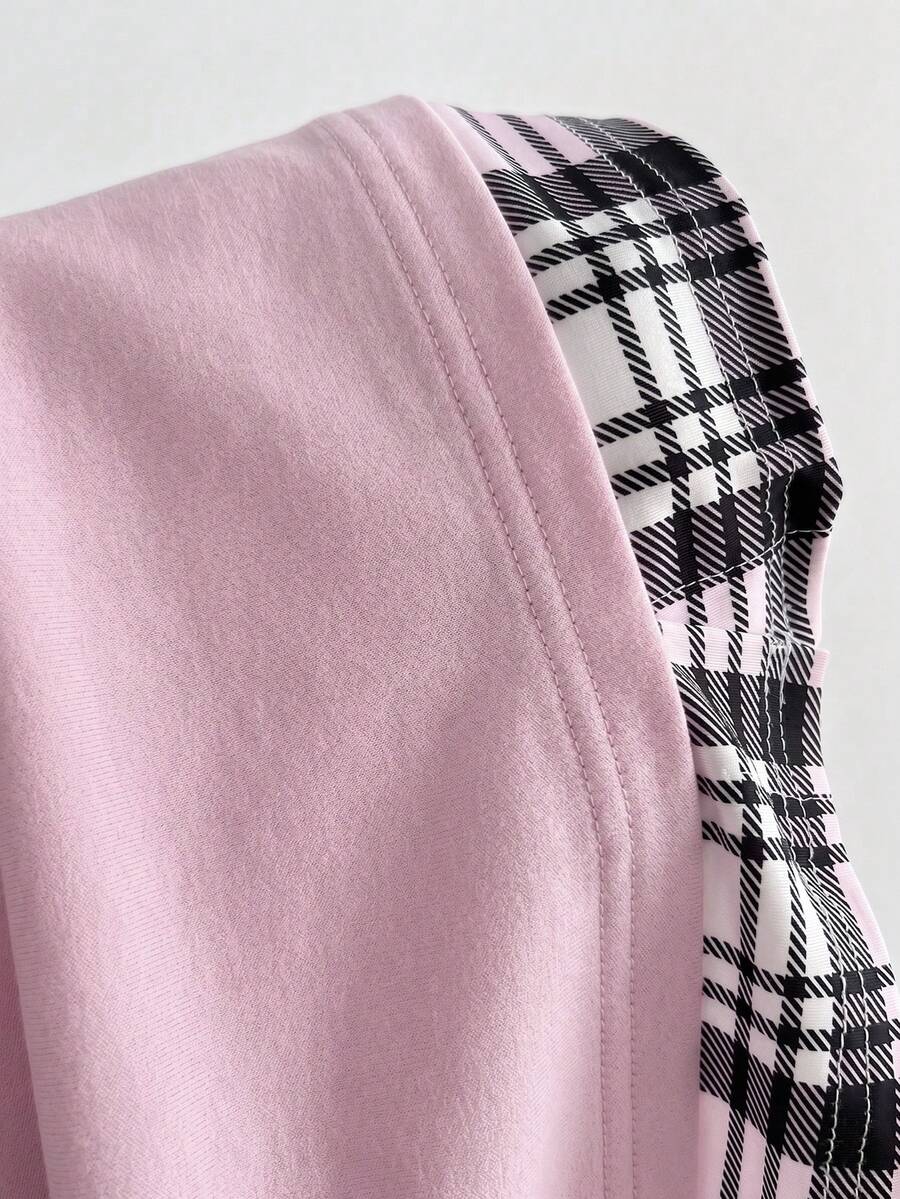 Women's black short sleeve slim fit 2-in-1 t-shirt with a plaid patchwork shirt collar detail.