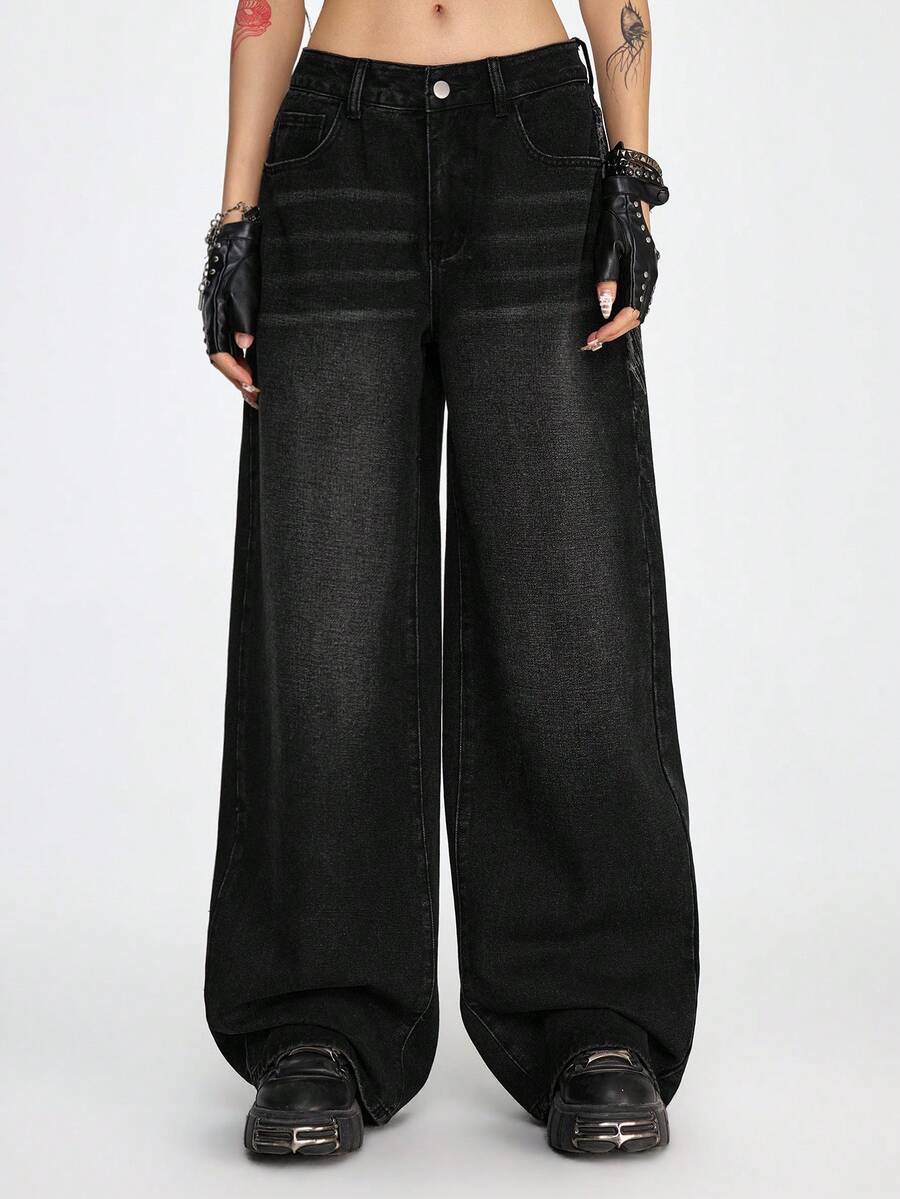 Women's gothic cross print baggy wide leg jeans made from denim with zipper fly and loose fit.