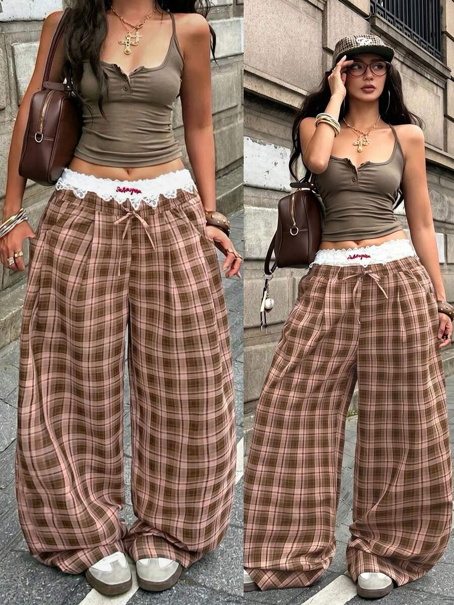 Women's loose fit brown and tan plaid wide leg pants featuring an elastic drawstring waist and side pockets.