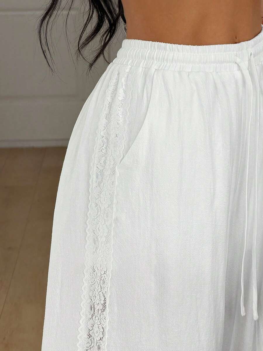 Women's loose fit straight leg lounge pants in textured knit fabric featuring an elastic drawstring waist and side pockets