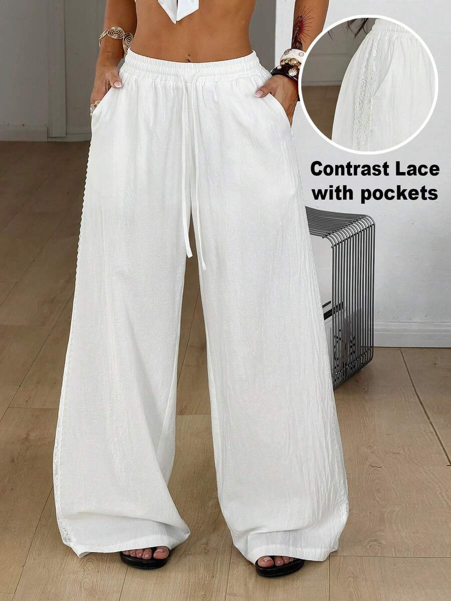 Women's loose fit straight leg lounge pants in textured knit fabric featuring an elastic drawstring waist and side pockets