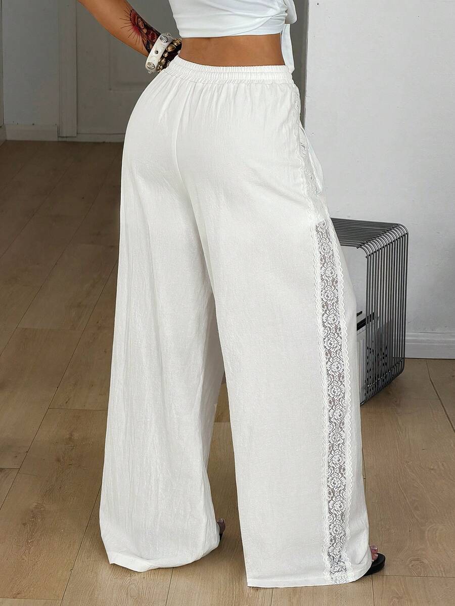 Women's loose fit straight leg lounge pants in textured knit fabric featuring an elastic drawstring waist and side pockets