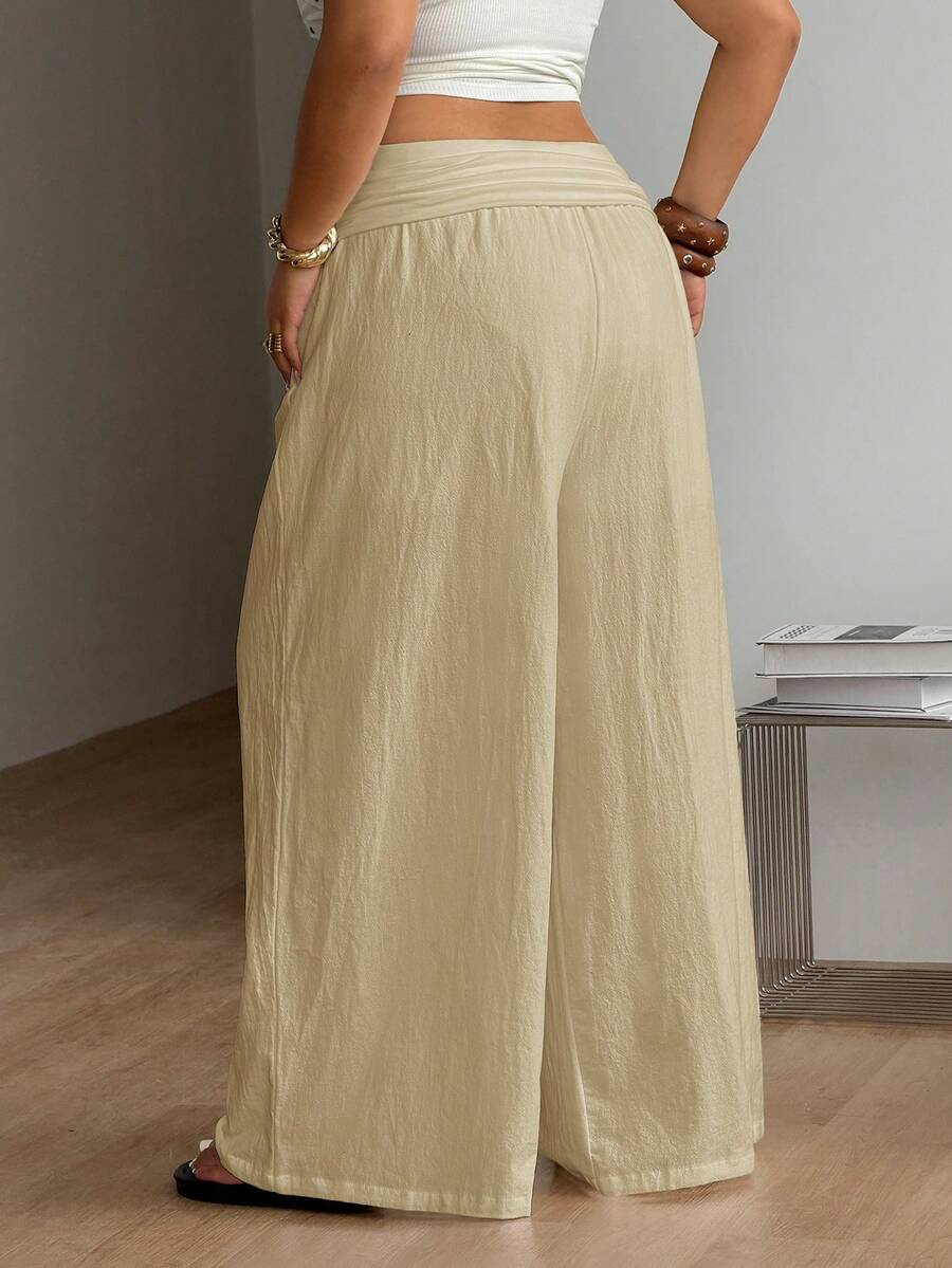 Apricot plus size wide leg pants made of 100% cotton with a high waist and relaxed loose fit.