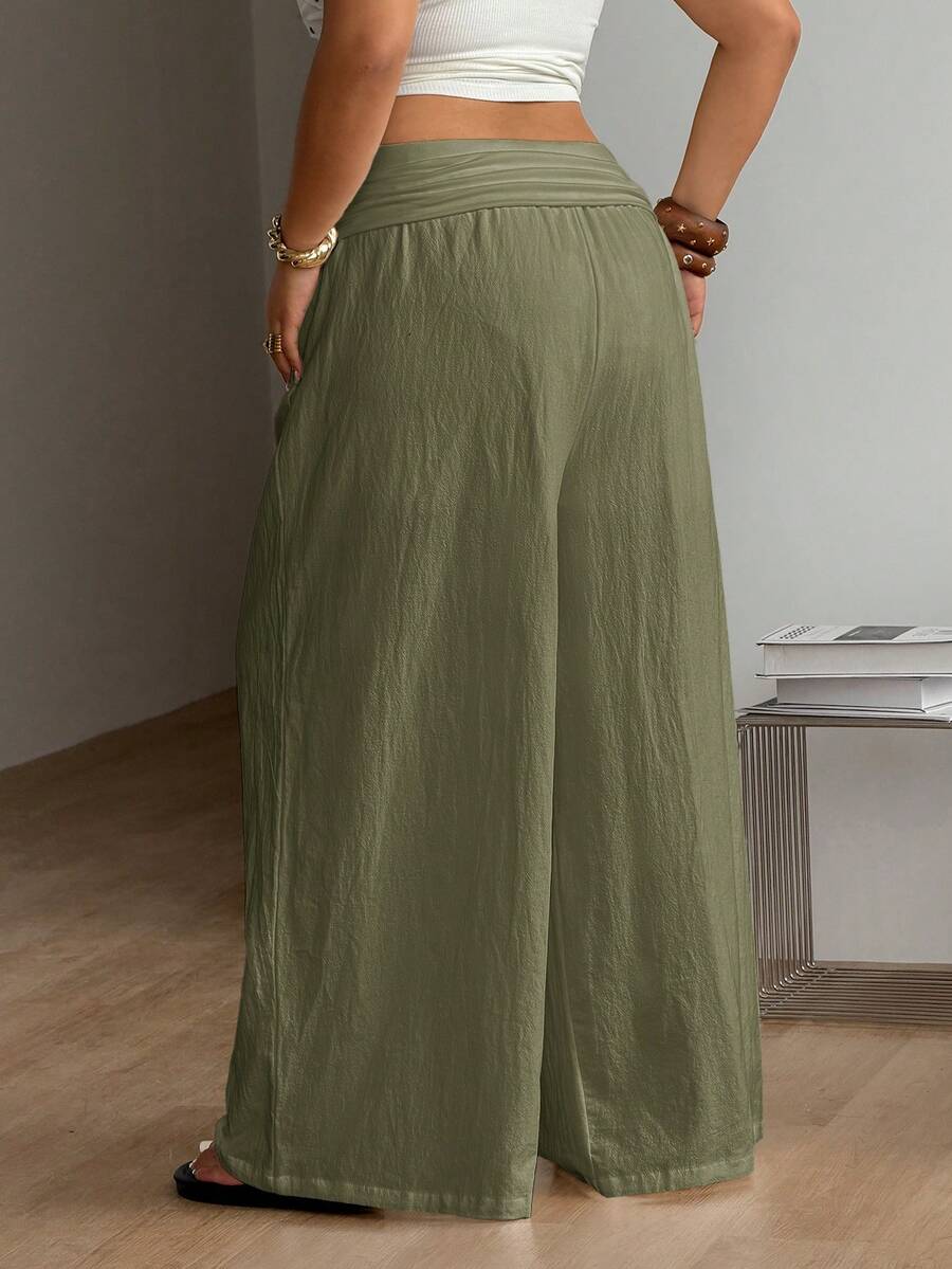 Women's plus size wide leg cotton pants featuring a relaxed loose fit and high waist design.