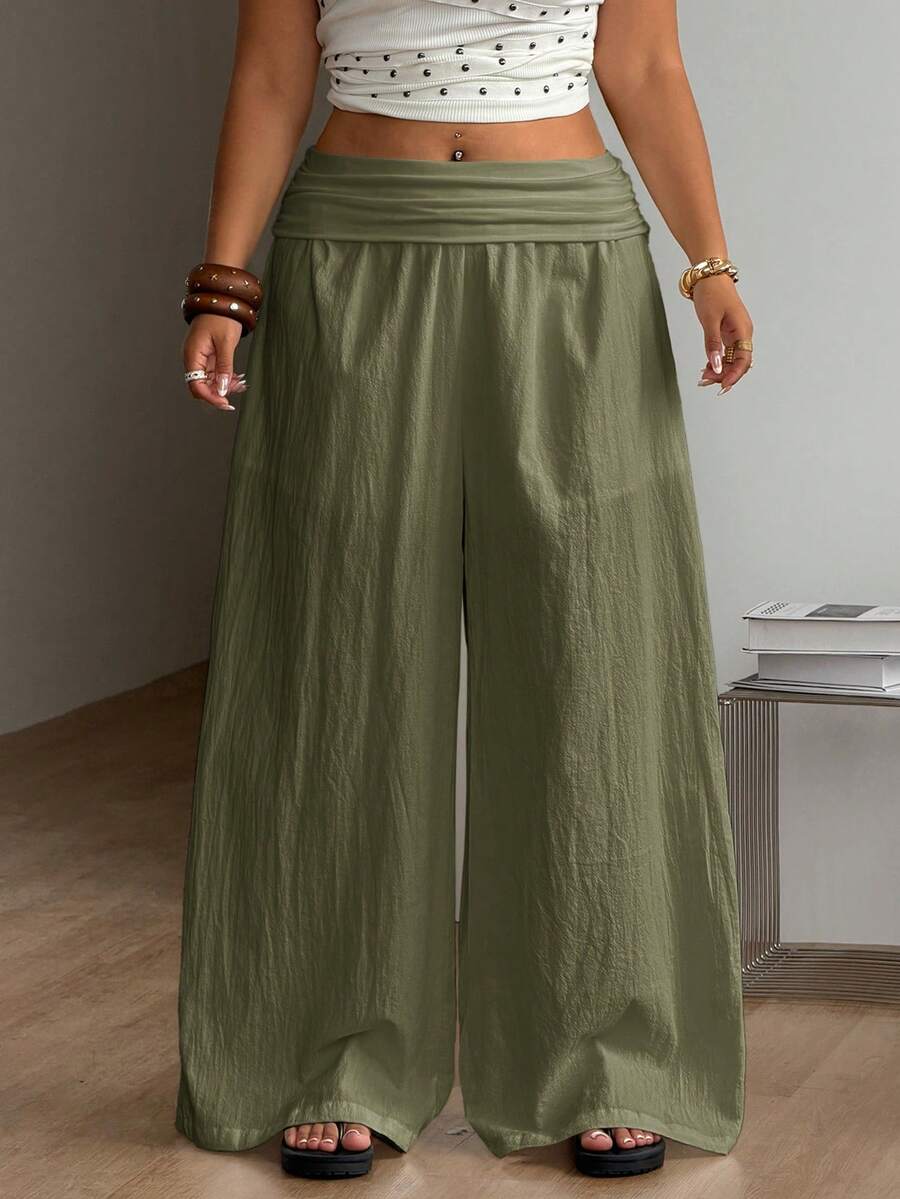Women's plus size wide leg cotton pants featuring a relaxed loose fit and high waist design.