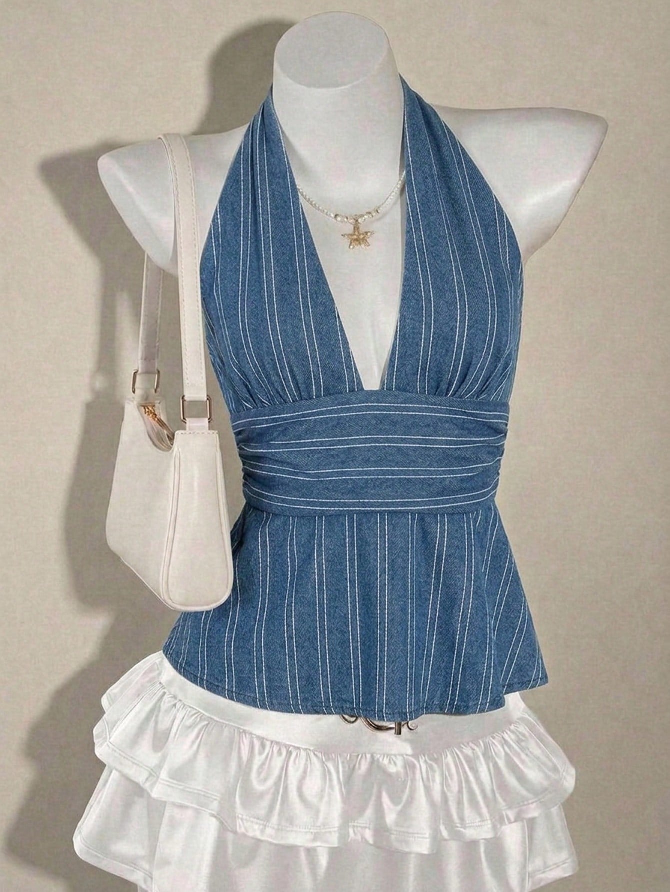 White women's deep V-neck halter tank top with ruched waist, backless design, rib-knit texture, and ruffle hem