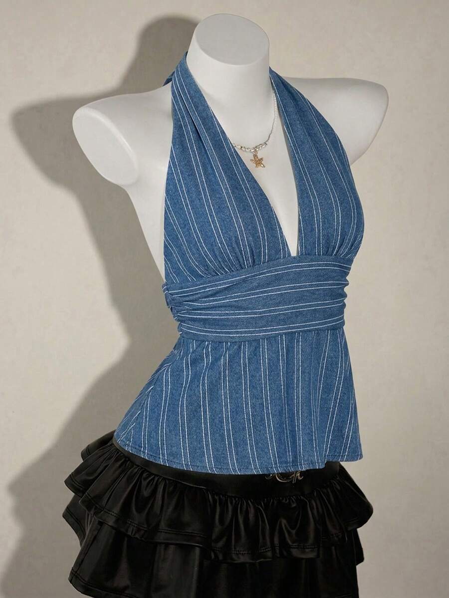White women's deep V-neck halter tank top with ruched waist, backless design, rib-knit texture, and ruffle hem