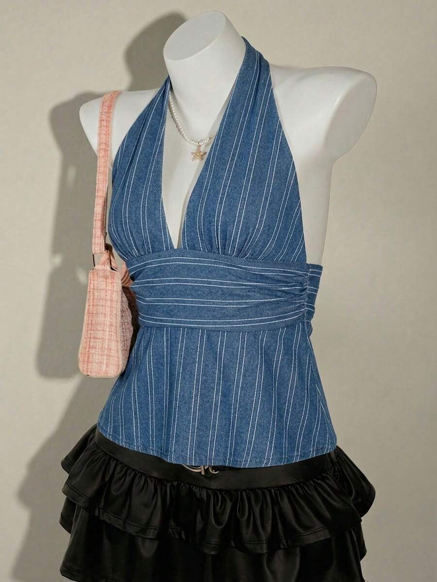 White women's deep V-neck halter tank top with ruched waist, backless design, rib-knit texture, and ruffle hem