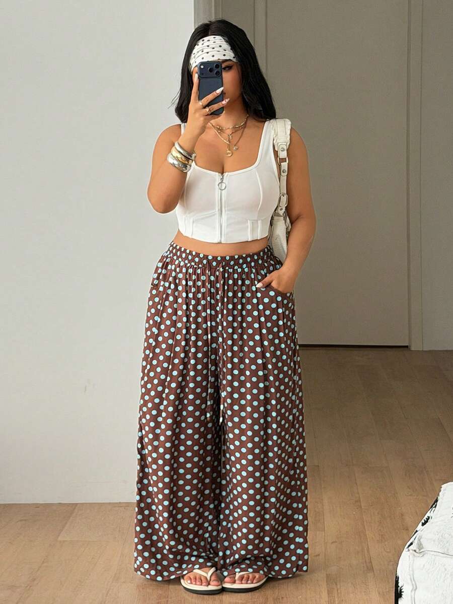Plus size women's striped loose straight leg cropped pants with pleated detailing and side pockets