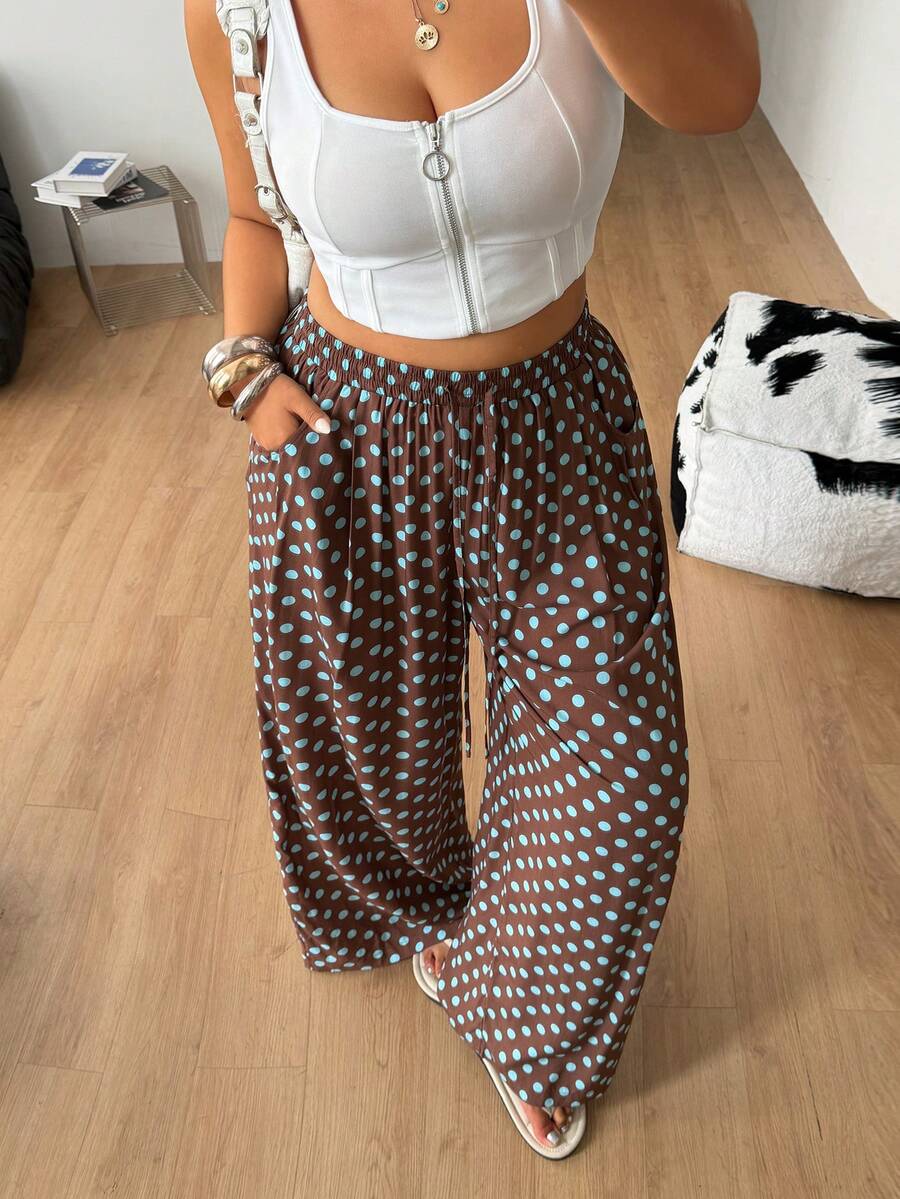 Plus size women's striped loose straight leg cropped pants with pleated detailing and side pockets
