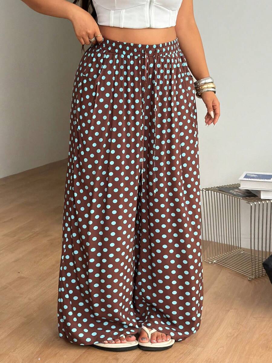 Plus size women's striped loose straight leg cropped pants with pleated detailing and side pockets