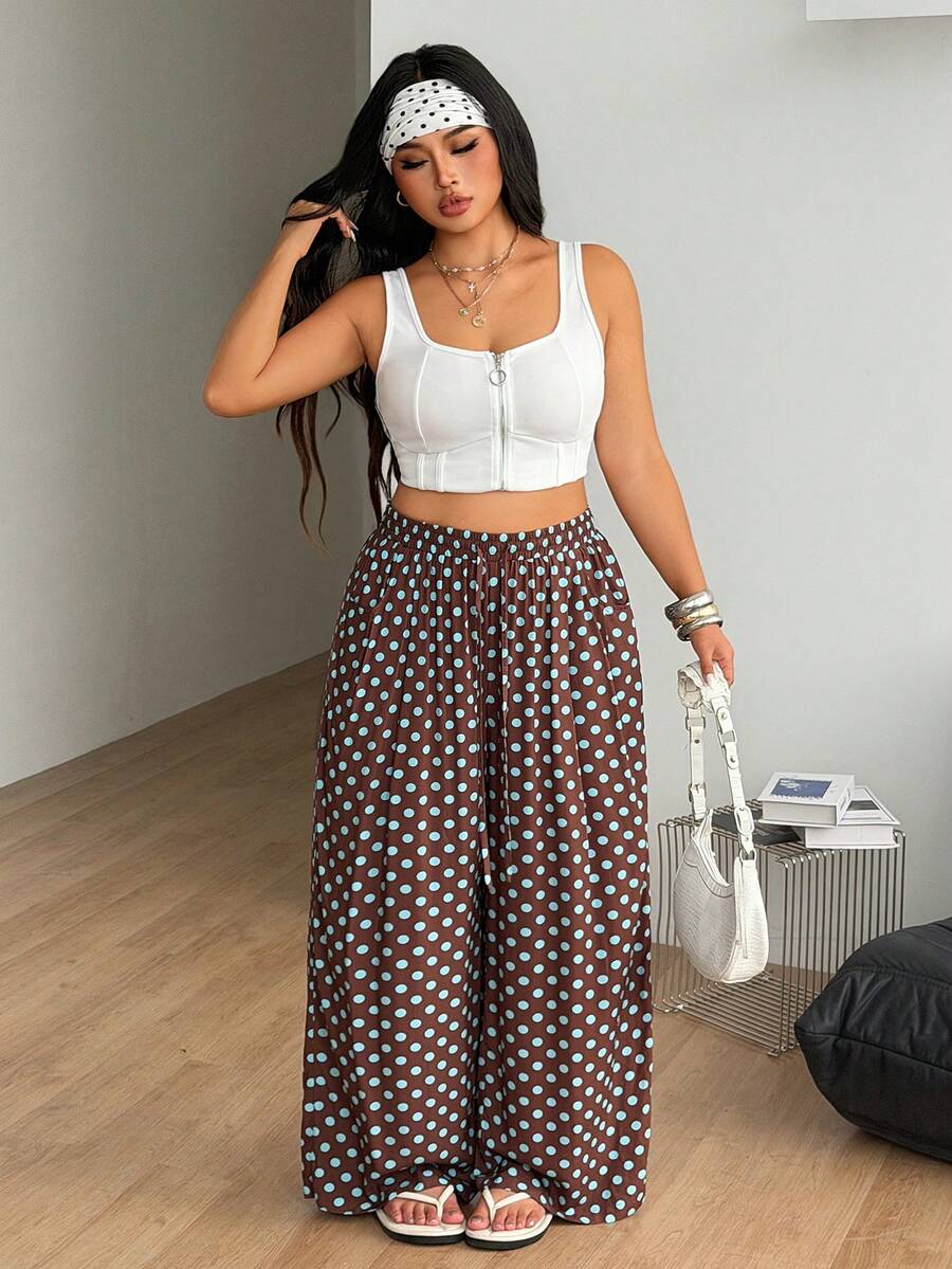 Plus size women's striped loose straight leg cropped pants with pleated detailing and side pockets