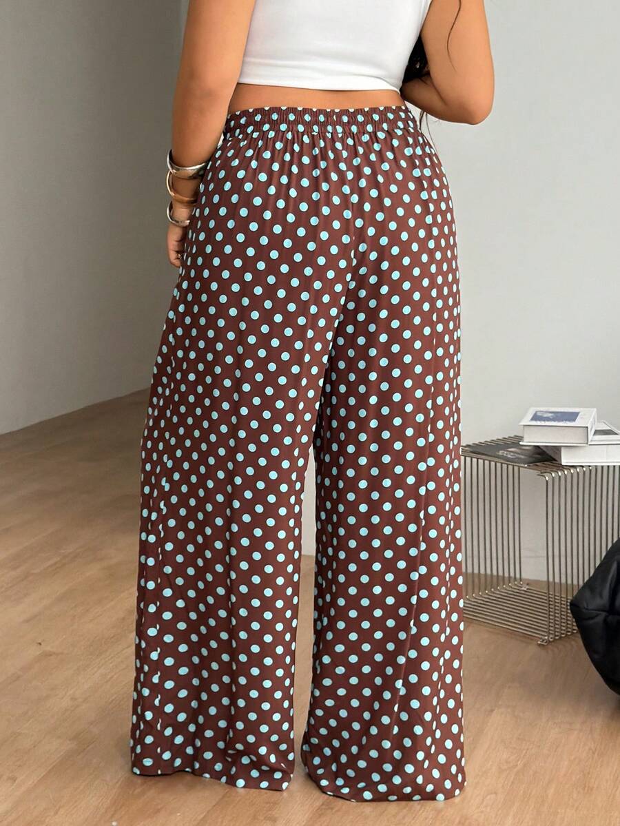 Plus size women's striped loose straight leg cropped pants with pleated detailing and side pockets