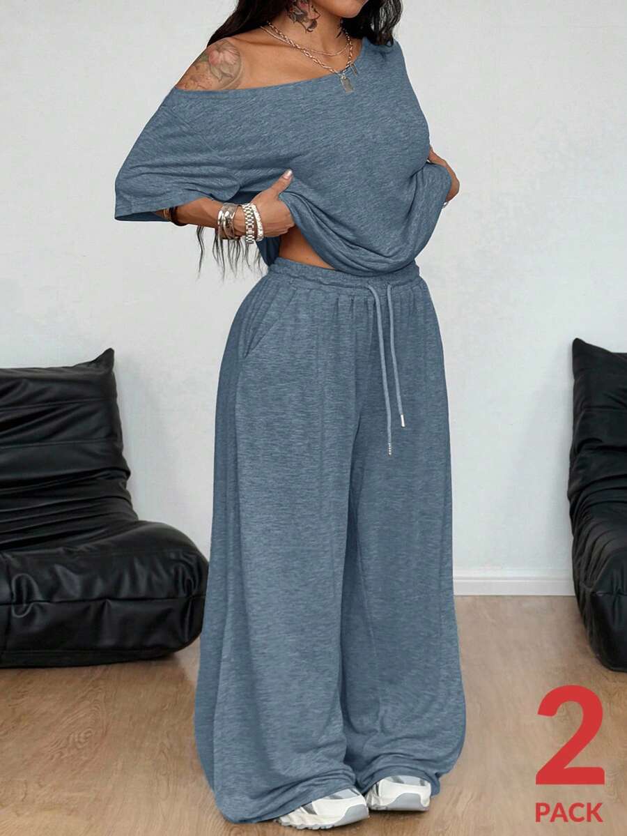Women's two-piece lounge set featuring a loose drop shoulder asymmetrical neck short sleeve t-shirt and wide-leg knit pants with pockets.