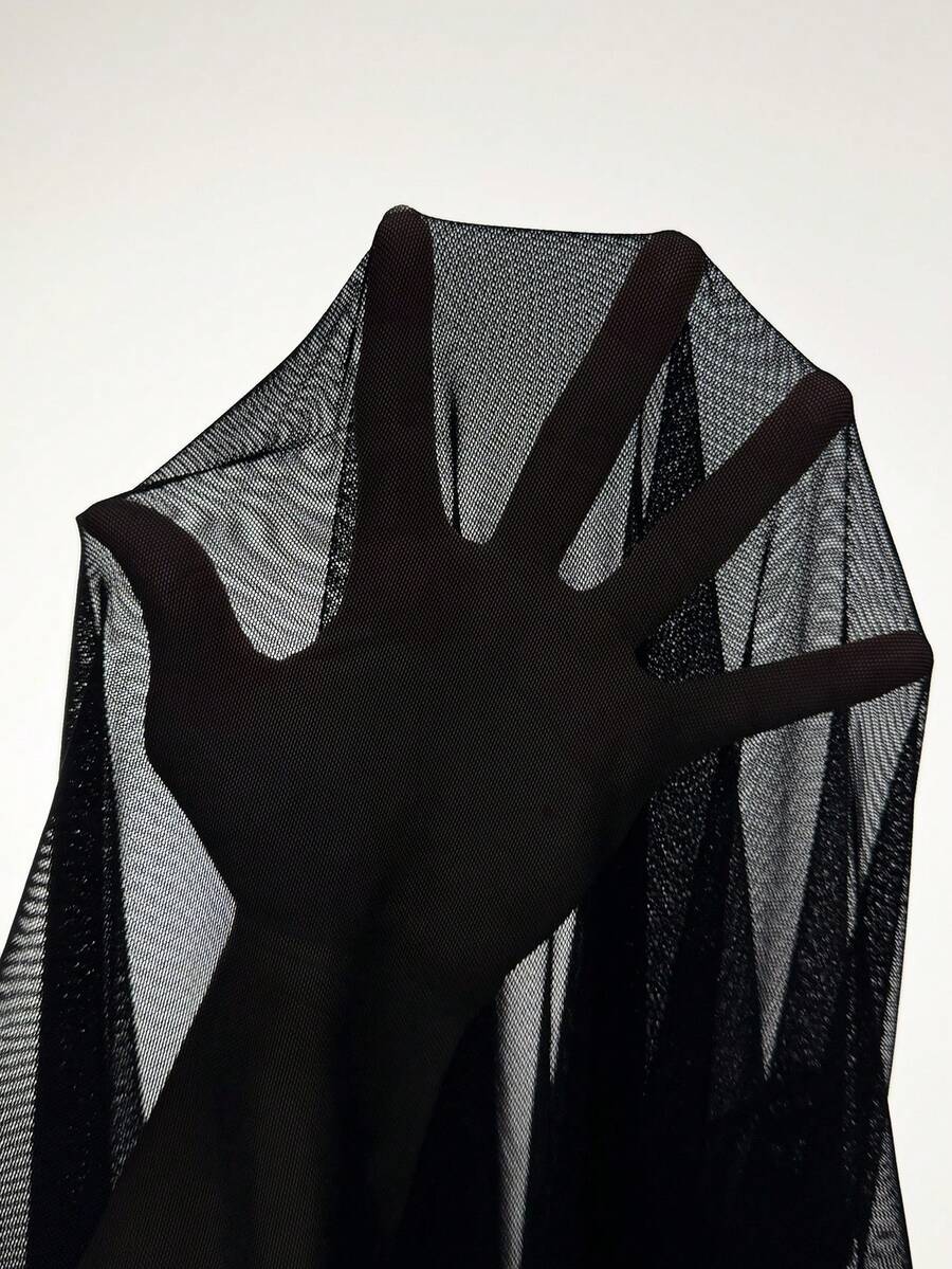 Women's plus size black sheer mesh top featuring a loose fit, round neck, and drop shoulder half sleeves.