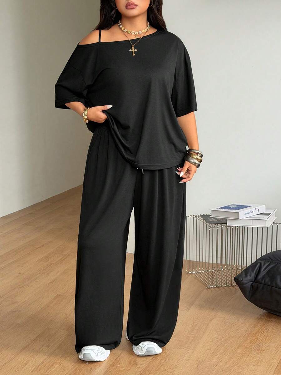 Women's two-piece lounge set featuring a loose drop shoulder asymmetrical neck short sleeve t-shirt and wide-leg knit pants with pockets.