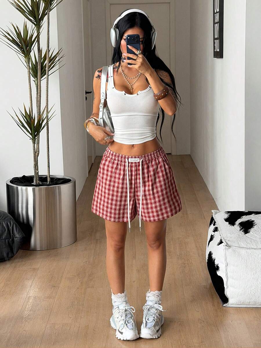 Women's casual drawstring track shorts featuring front pockets and embroidered details