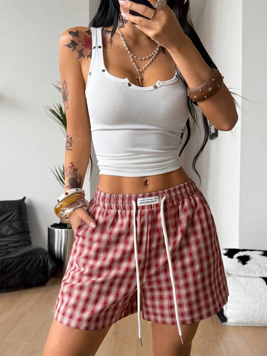 Women's casual drawstring track shorts featuring front pockets and embroidered details