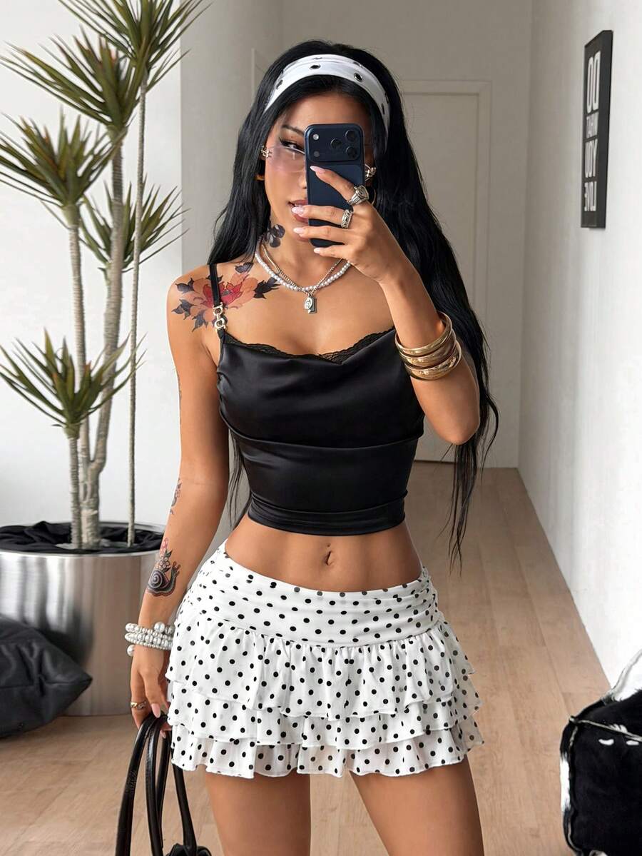 Women's white low waist tiered mini skirt featuring ruched detailing and a slight-stretch knitted fabric.