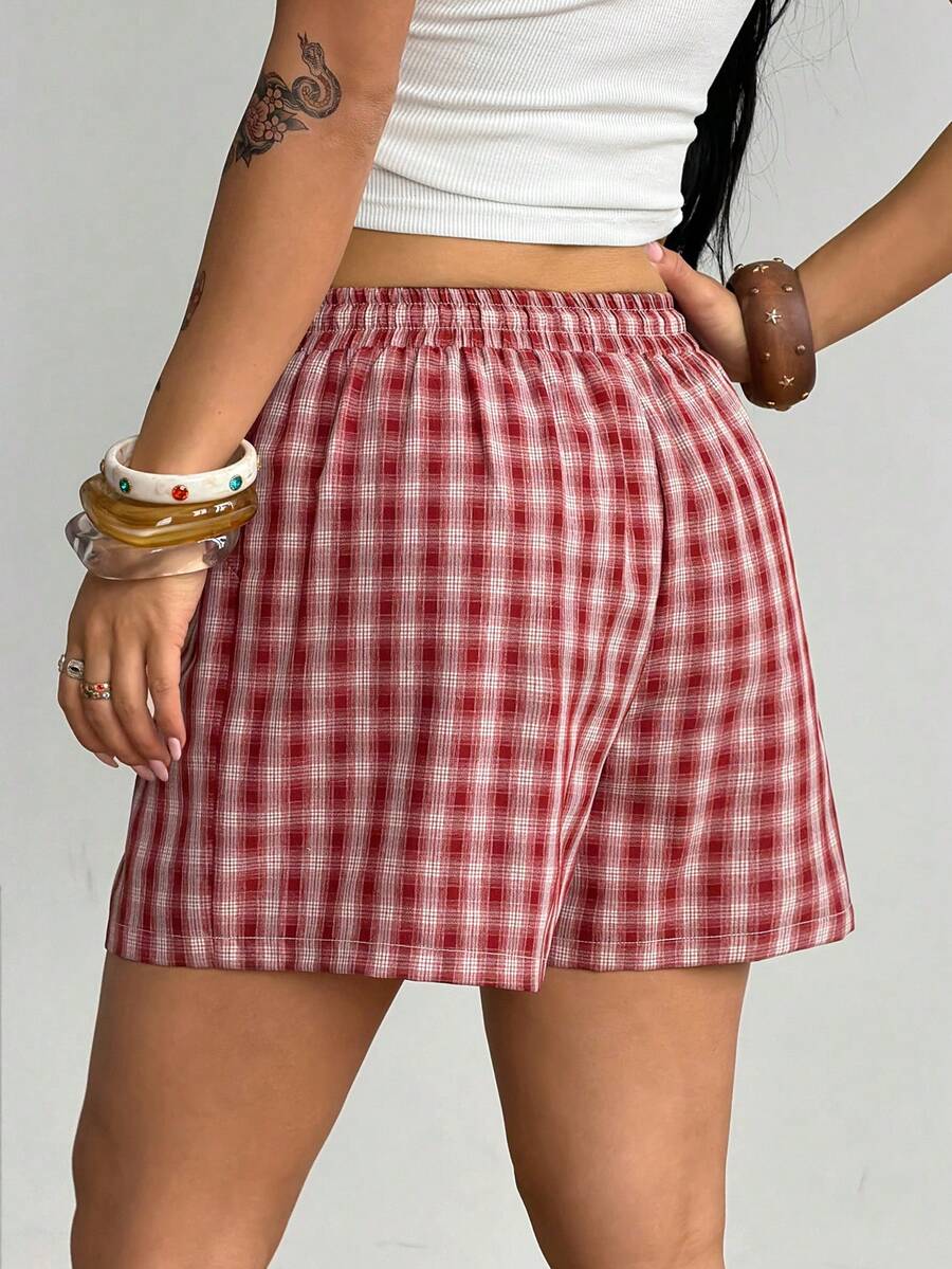 Women's casual drawstring track shorts featuring front pockets and embroidered details