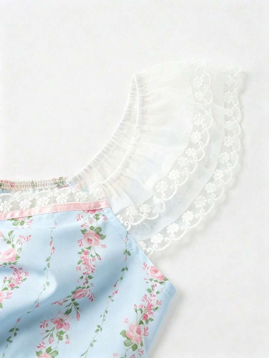 Vintage ditsy floral print sleeveless women's blouse with square neck, ruffle trim, and slim fit style.