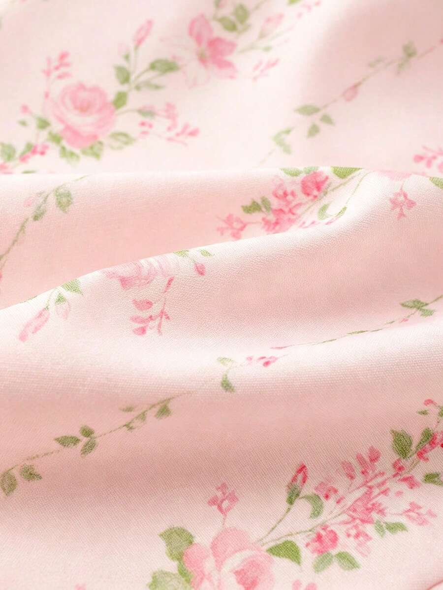 Vintage ditsy floral print sleeveless women's blouse with square neck, ruffle trim, and slim fit style.