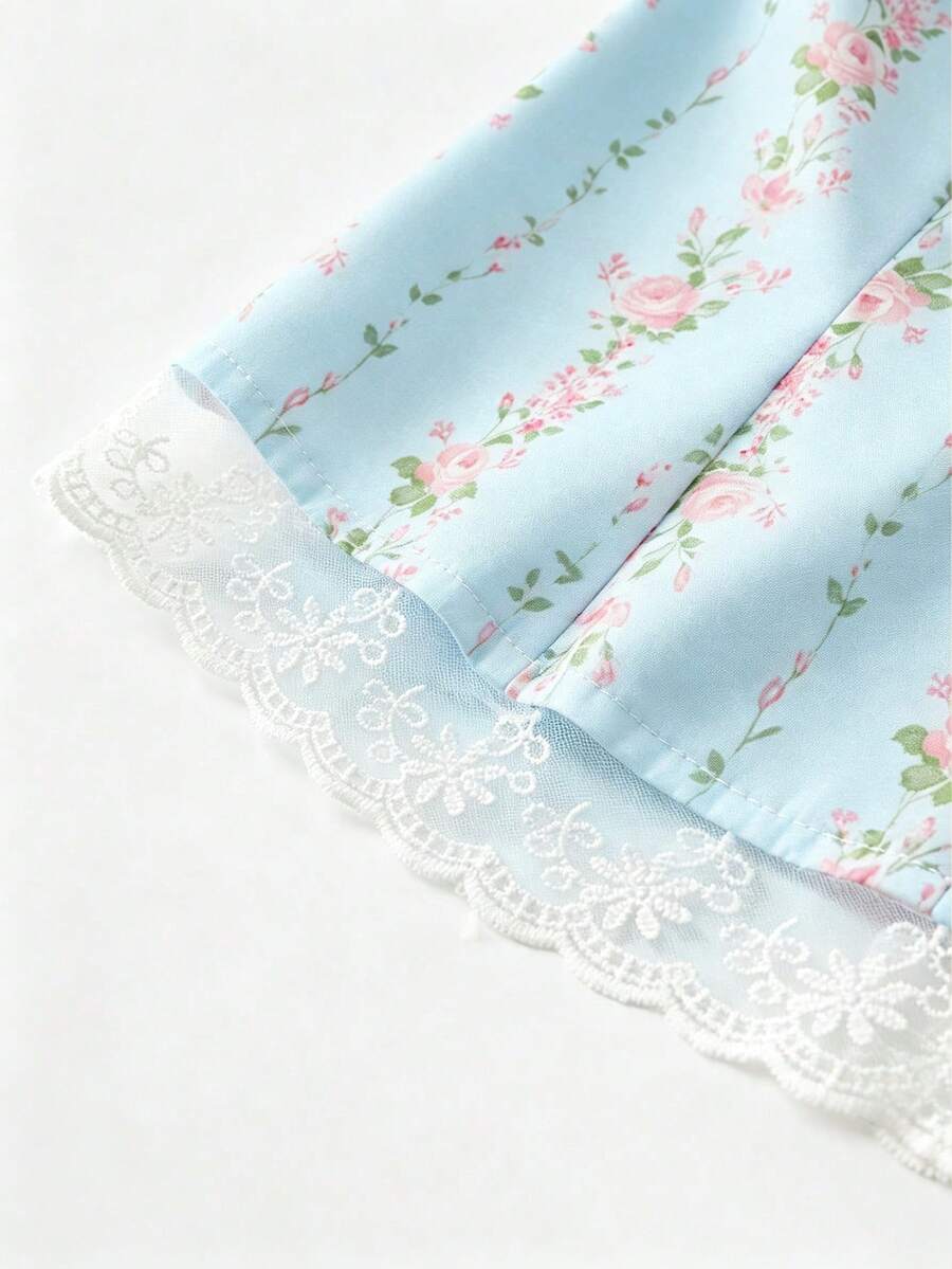 Vintage ditsy floral print sleeveless women's blouse with square neck, ruffle trim, and slim fit style.