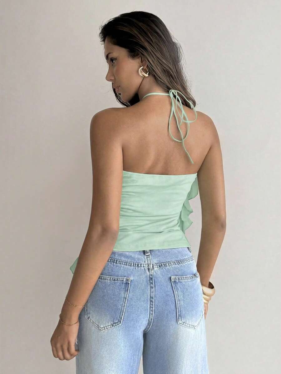 Women's sleeveless halter neck top featuring tiered ruffle layers, a backless cut, and an asymmetrical hem.