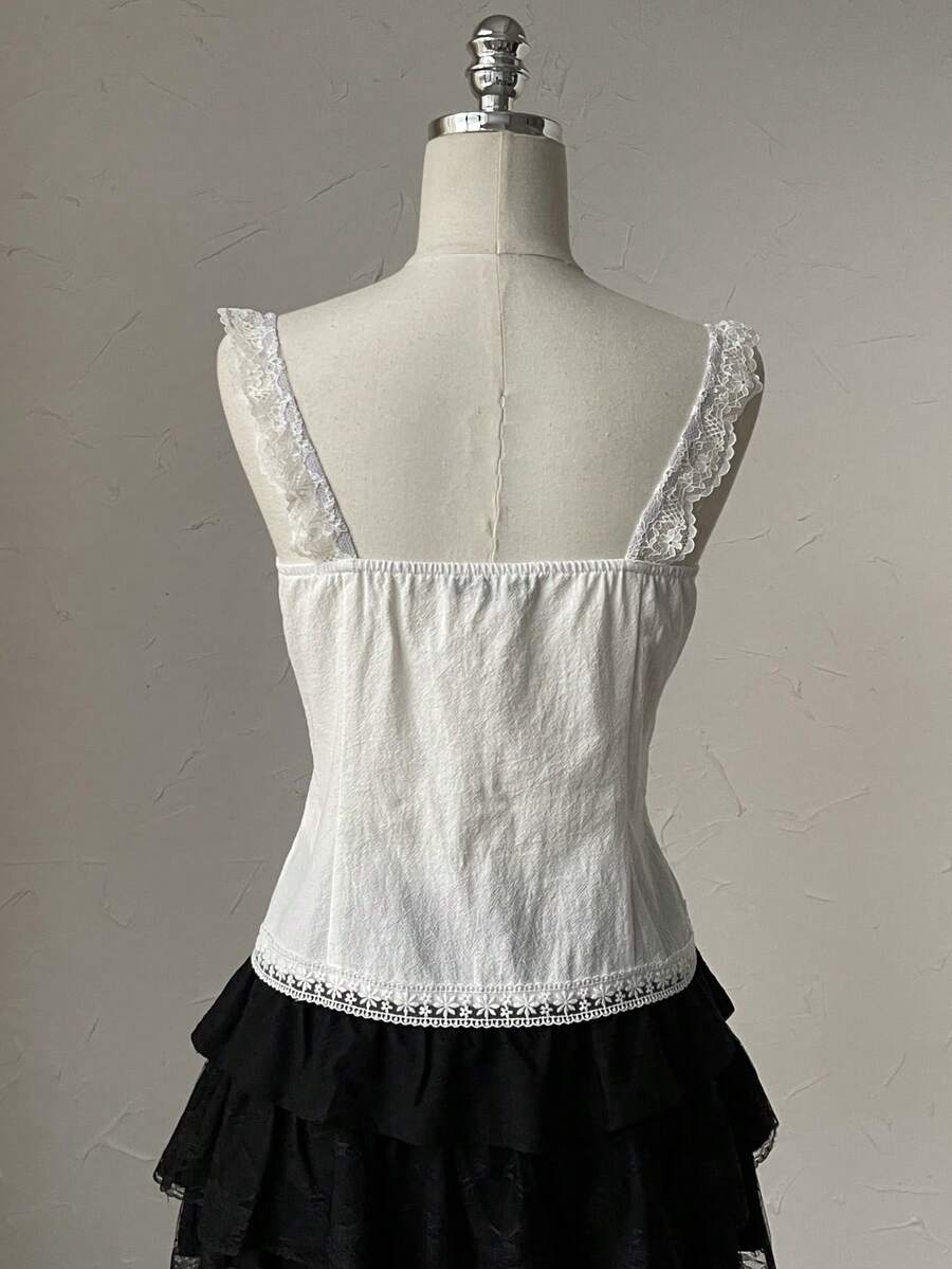 Attitoon women's Y2K style slim fit camisole top featuring contrast lace trim, spaghetti straps, plant print design, and an asymmetrical hem.