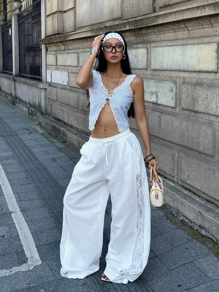 Women's loose fit straight leg lounge pants in textured knit fabric featuring an elastic drawstring waist and side pockets