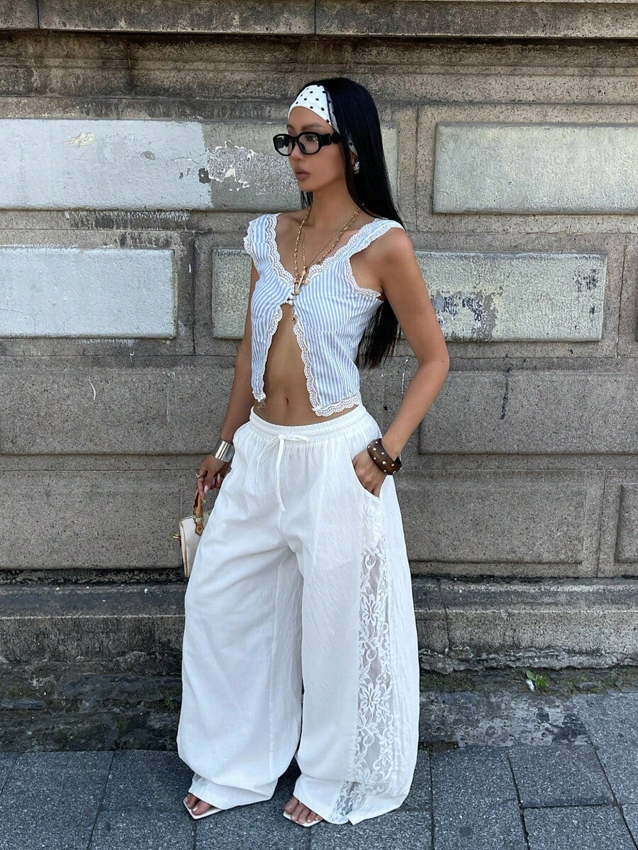 Women's loose fit straight leg lounge pants in textured knit fabric featuring an elastic drawstring waist and side pockets