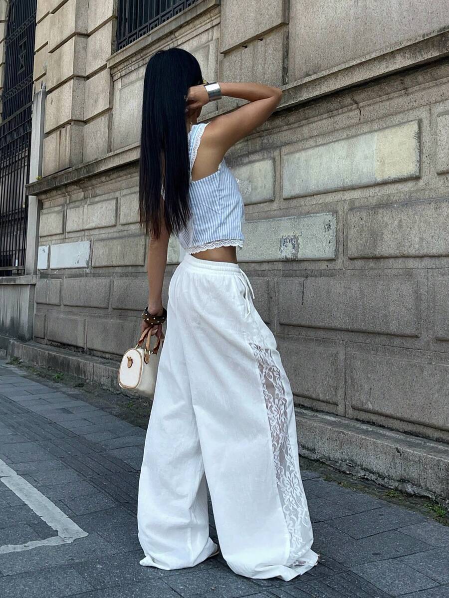 Women's loose fit straight leg lounge pants in textured knit fabric featuring an elastic drawstring waist and side pockets
