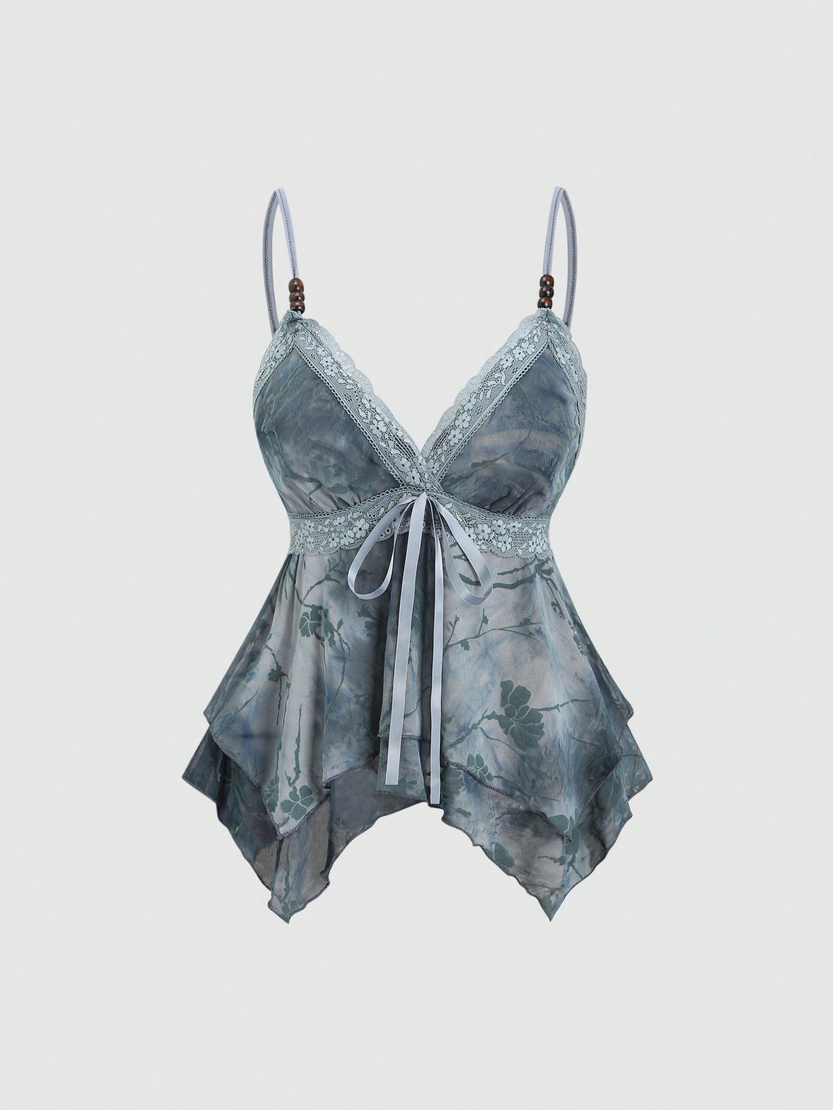 Women's black spaghetti strap tank top featuring contrast lace details, asymmetric ruffle hem, and slim fit design.