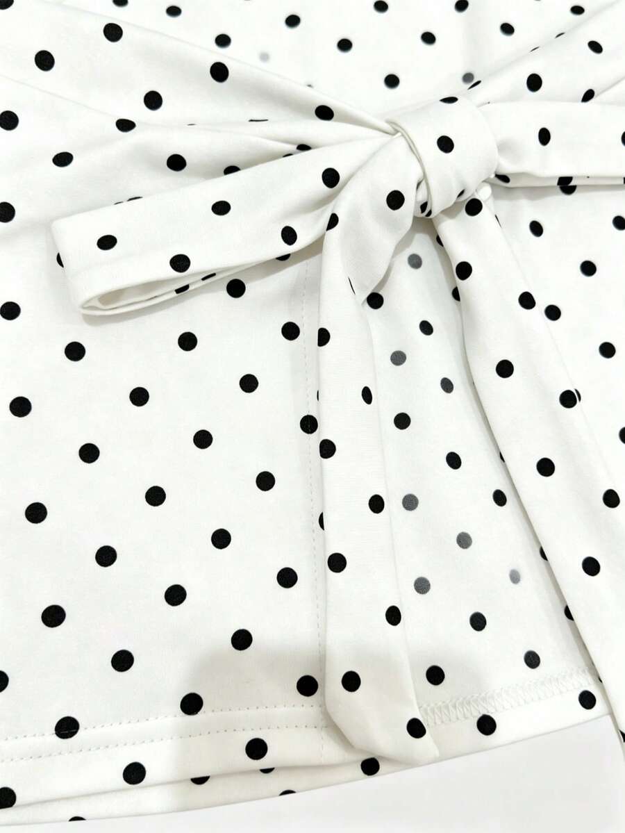 Women's cowl neck tie polka dot pleated tank blouse with ruched details and a regular fit