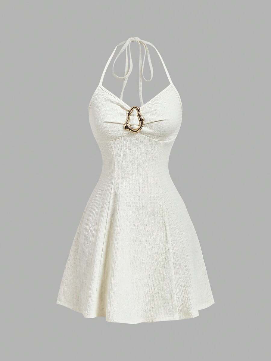 Women's apricot halter mini dress with backless knot and ring detail, sleeveless cami style, flared hem, and boho vacation look
