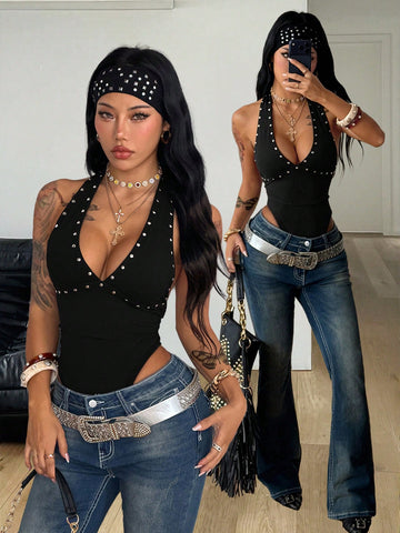 Women's black halter bodysuit featuring silver studded rivet details on a stretchy slim-fit sleeveless top.