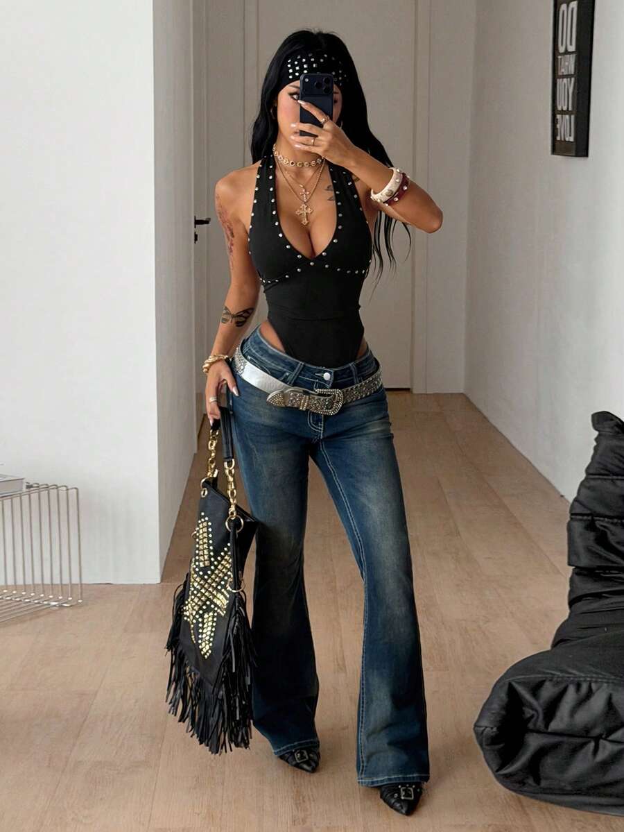 Women's black halter bodysuit featuring silver studded rivet details on a stretchy slim-fit sleeveless top.