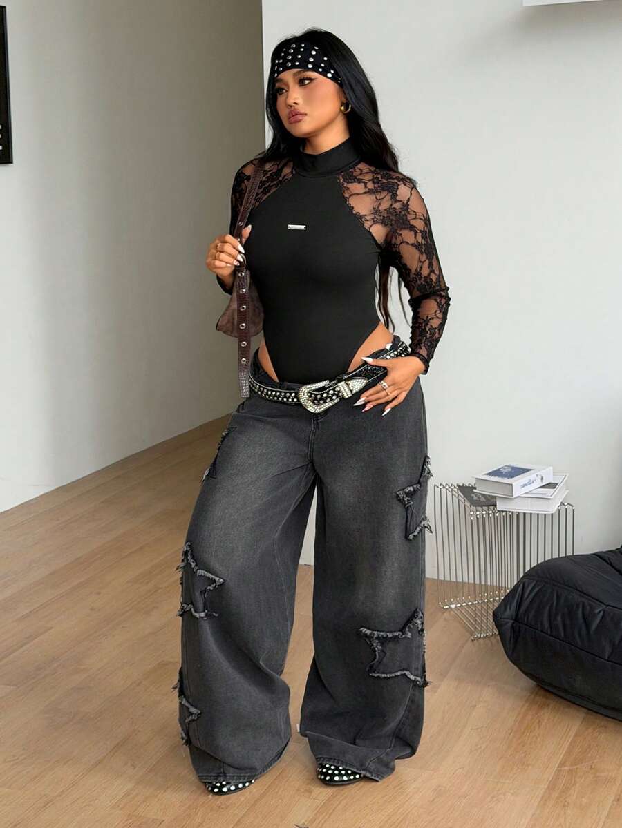 Women's black long sleeve bodysuit with sheer contrast lace raglan sleeves and stand collar.