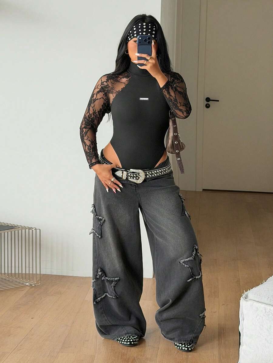 Women's black long sleeve bodysuit with sheer contrast lace raglan sleeves and stand collar.