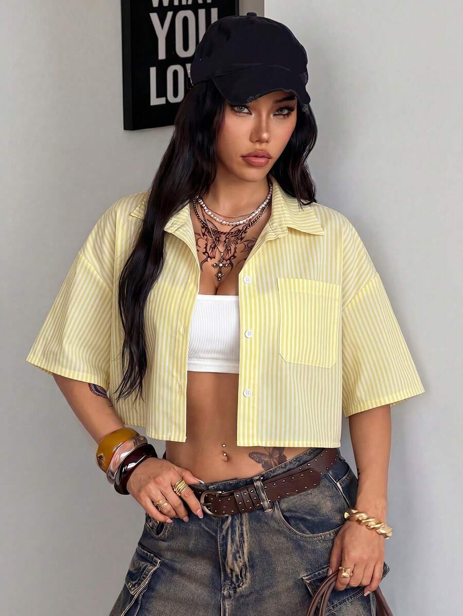 Women's plaid crop shirt with button front, chest pocket, short sleeves, and loose casual fit.