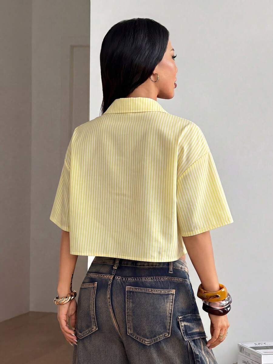 Women's plaid crop shirt with button front, chest pocket, short sleeves, and loose casual fit.