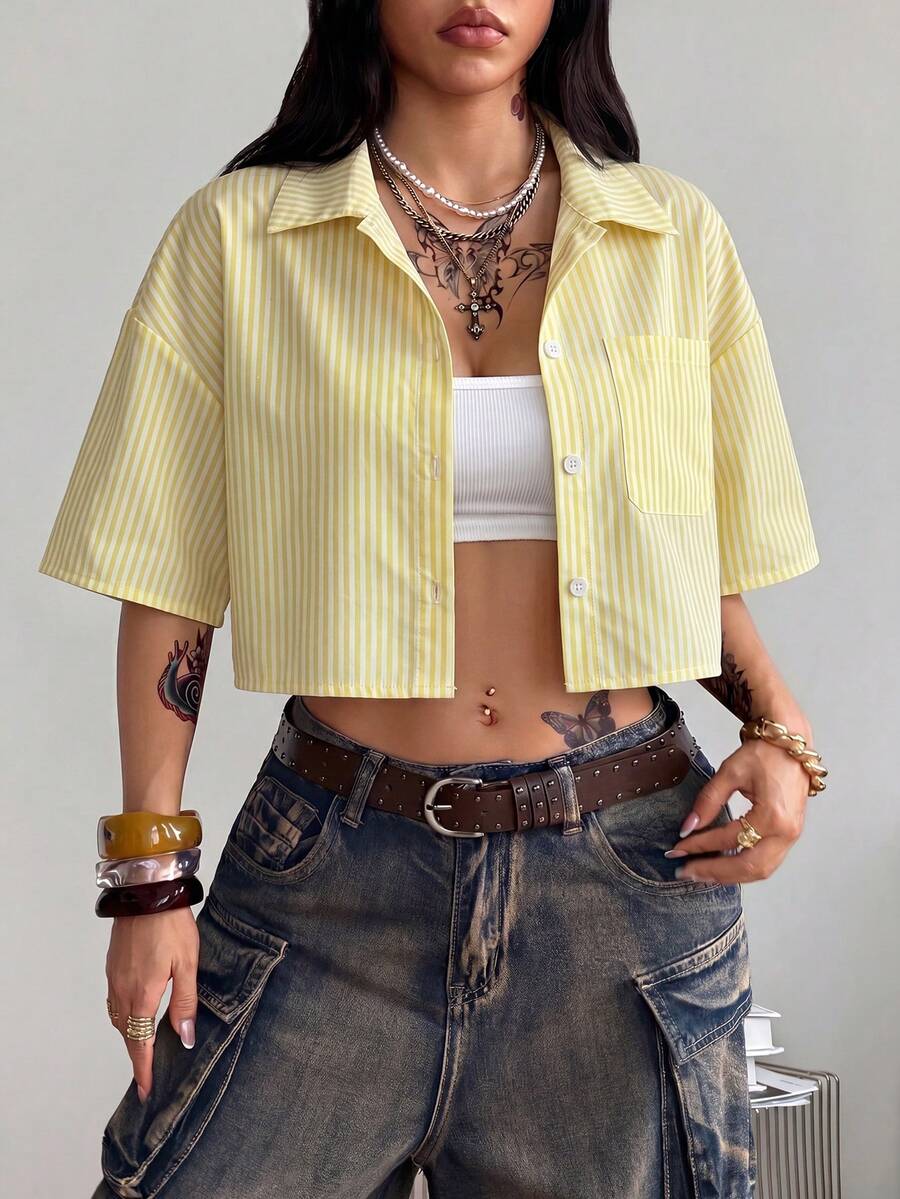 Women's plaid crop shirt with button front, chest pocket, short sleeves, and loose casual fit.