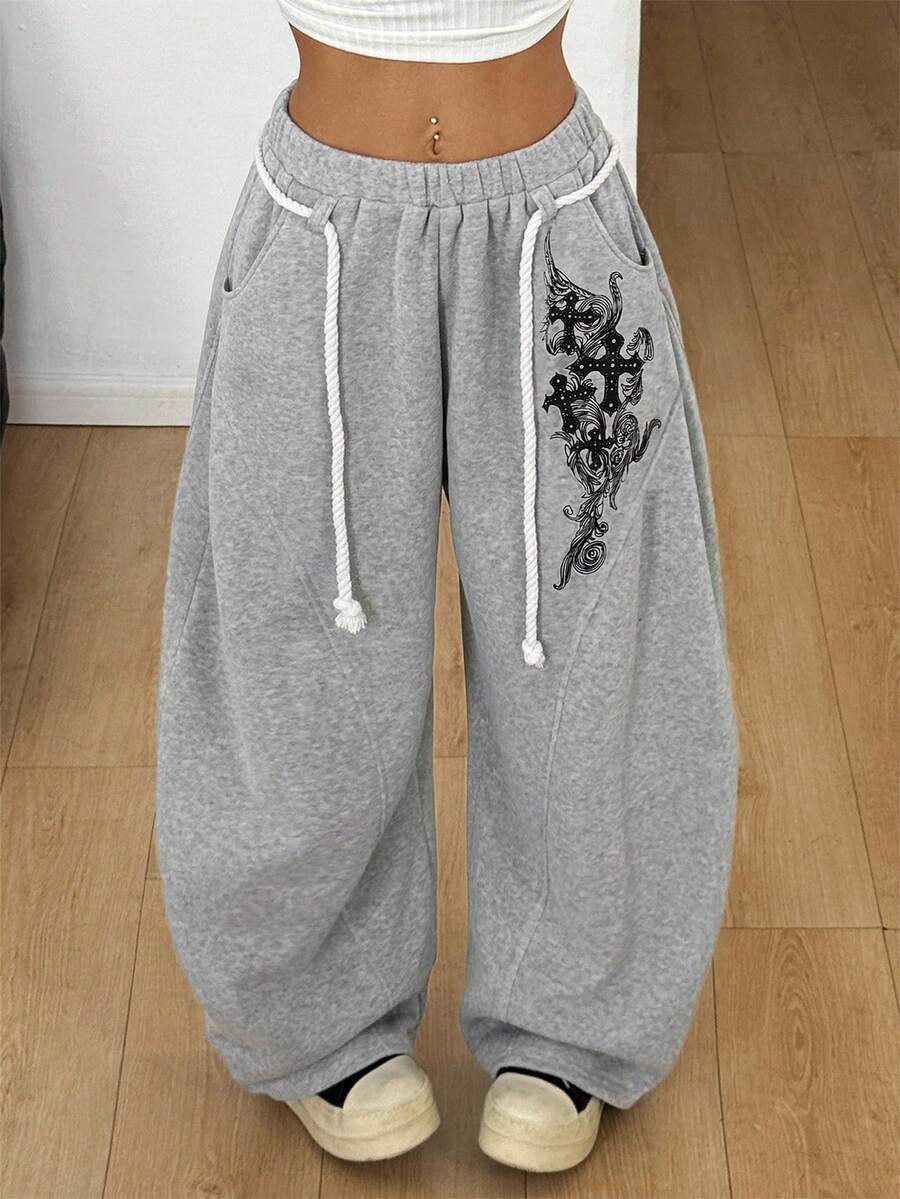Women's casual grey plaid sweatpants featuring an elastic drawstring waistband, side pockets, and a relaxed loose fit.