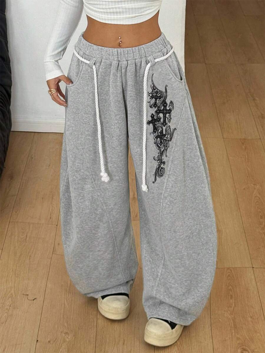 Women's casual grey plaid sweatpants featuring an elastic drawstring waistband, side pockets, and a relaxed loose fit.